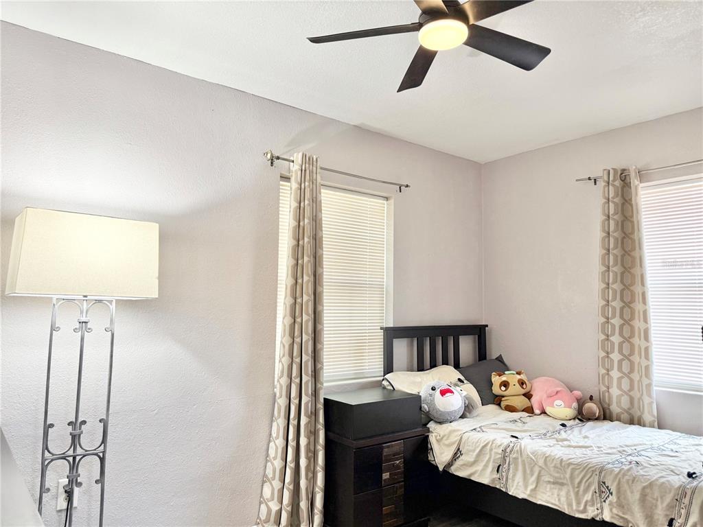 5846 Wyoming Avenue New Port Richey, FL 34652 - Photo 24 of 47 a bedroom with a bed and a window
