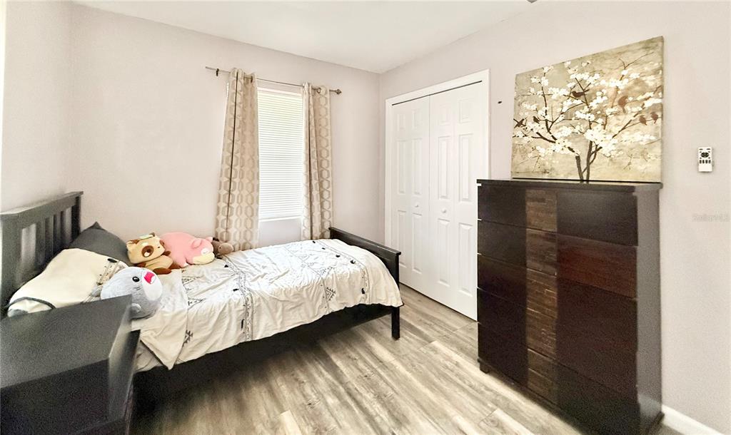 5846 Wyoming Avenue New Port Richey, FL 34652 - Photo 26 of 47 a bedroom with a bed and a window