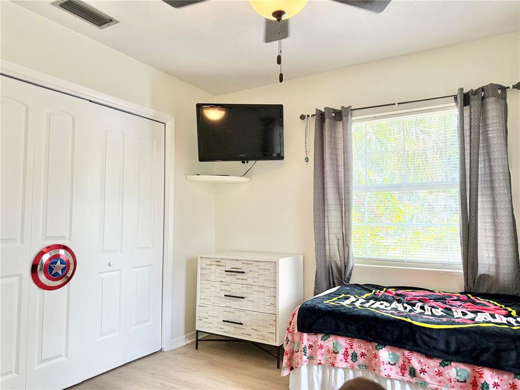 5846 Wyoming Avenue New Port Richey, FL 34652 - Photo 30 of 47 a bedroom with a bed and a window