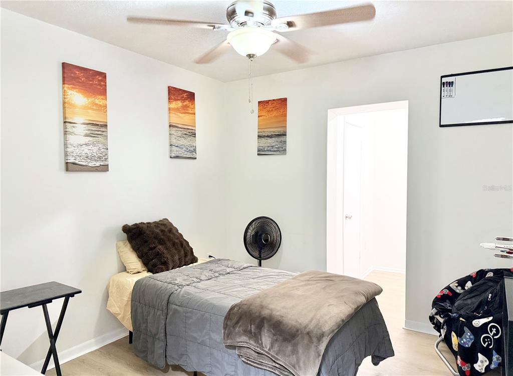 5846 Wyoming Avenue New Port Richey, FL 34652 - Photo 33 of 47 a bedroom with a bed and a window