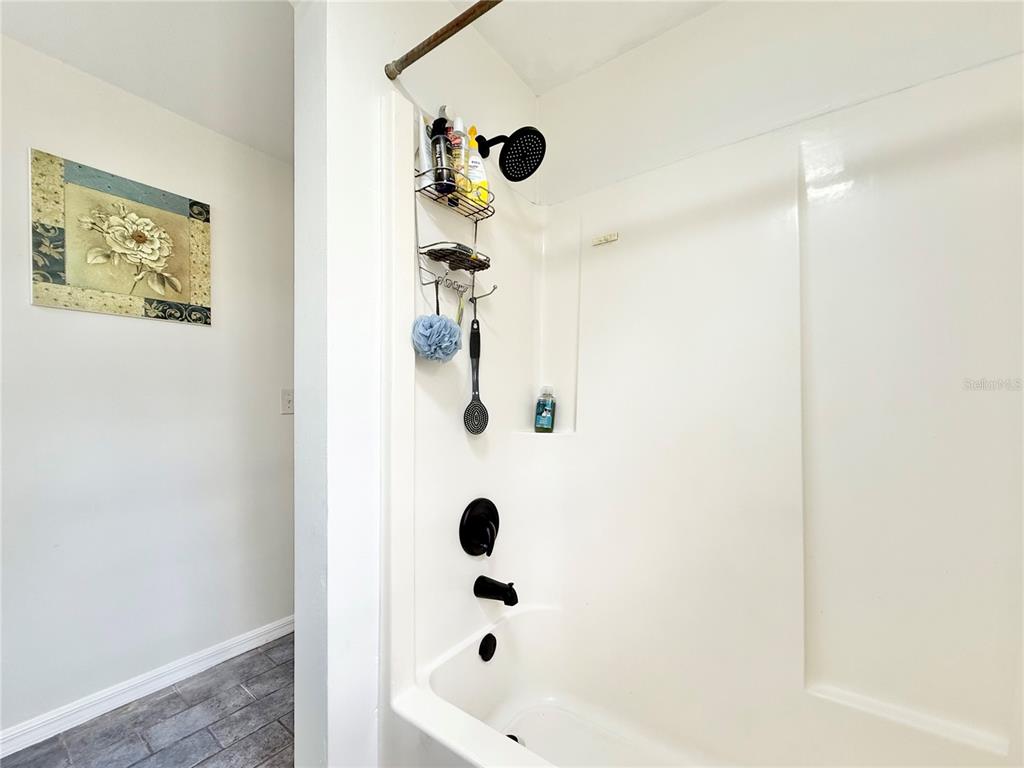 5846 Wyoming Avenue New Port Richey, FL 34652 - Photo 43 of 47 a bathroom with a shower