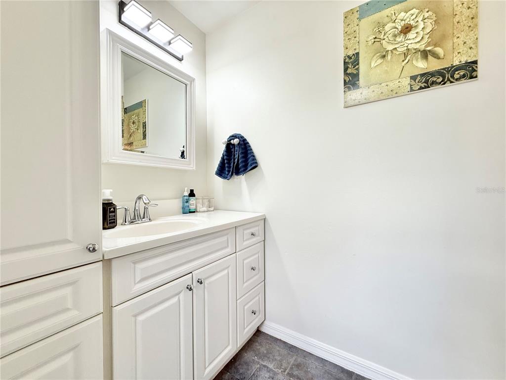 5846 Wyoming Avenue New Port Richey, FL 34652 - Photo 44 of 47 a bathroom with a sink vanity and mirror