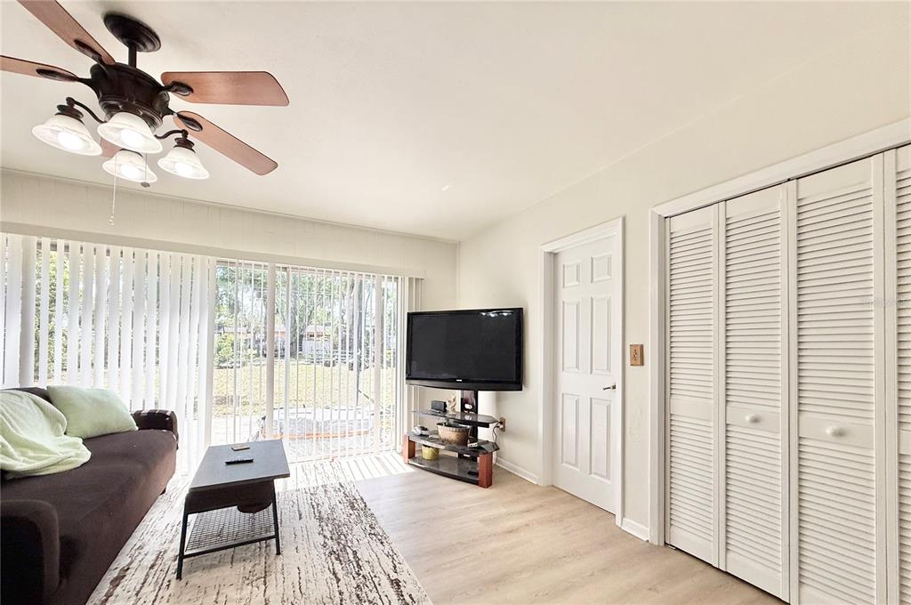 5846 Wyoming Avenue New Port Richey, FL 34652 - Photo 10 of 47 a living room with furniture and a flat screen tv