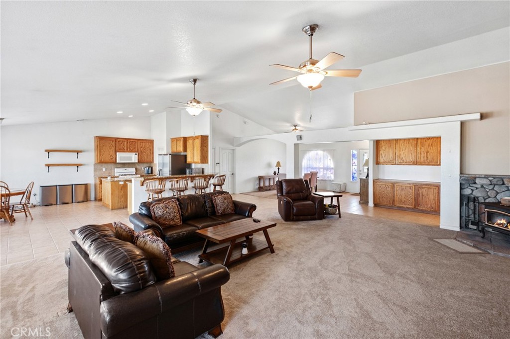 11025 El Esteban Road Phelan, CA 92371 - Photo 11 of 54 a living room with furniture and fireplace