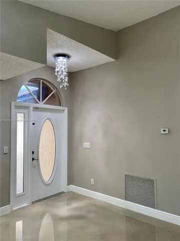 a view of a livingroom with washer and dryer