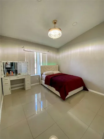 a spacious bathroom with a double vanity sink and a mirror