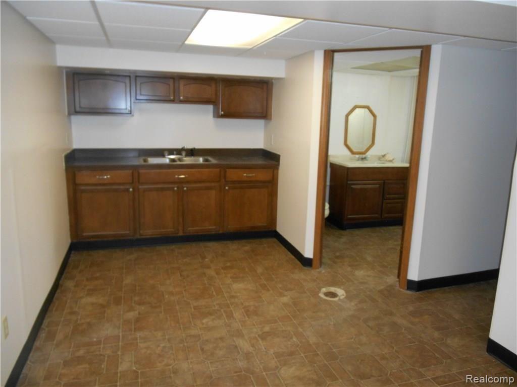 25754 Peter Kaltz Road Warren, MI 48091 - Photo 47 of 68 FINISHED KITCHENETTE AND BATHROOM IN BASEMENT