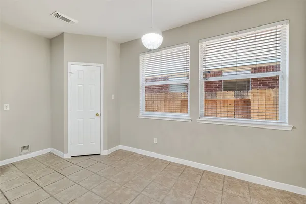 a kitchen with stainless steel appliances granite countertop a stove sink and cabinets