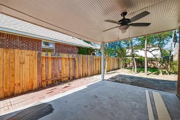 a view of walk in closet with wooden floor