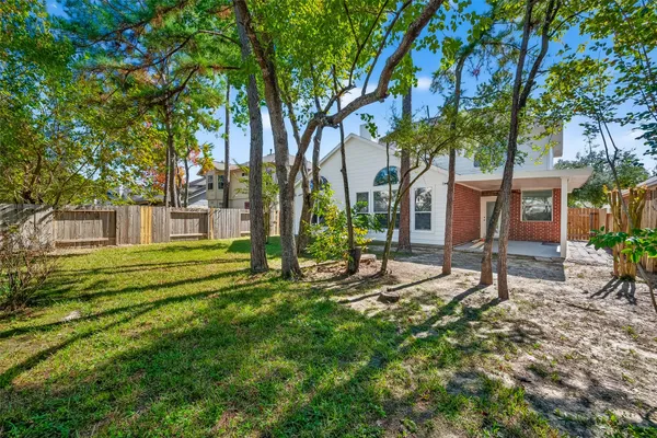 a view of an empty room with a ceiling fan