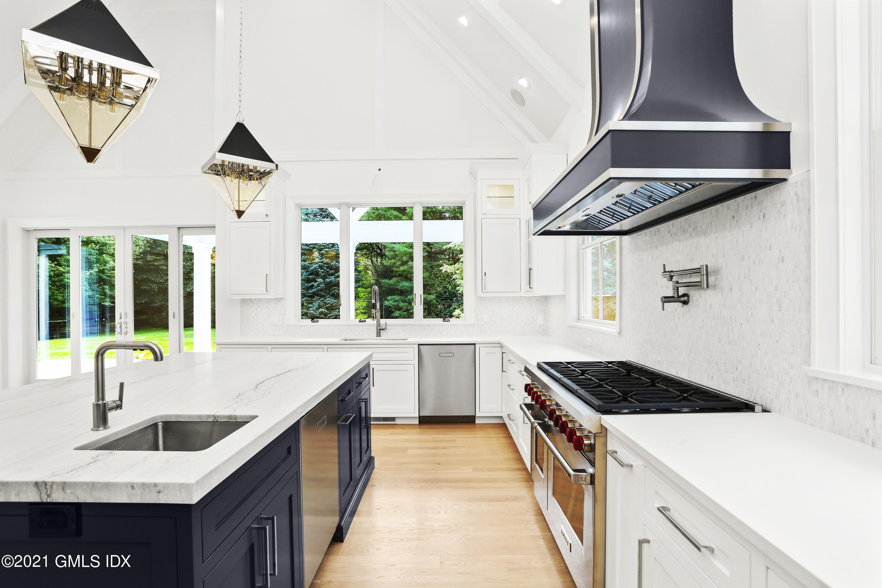 633 Round Hill Road Greenwich, CT 06831 - Photo 4 of 26 a kitchen that has a sink and a stove