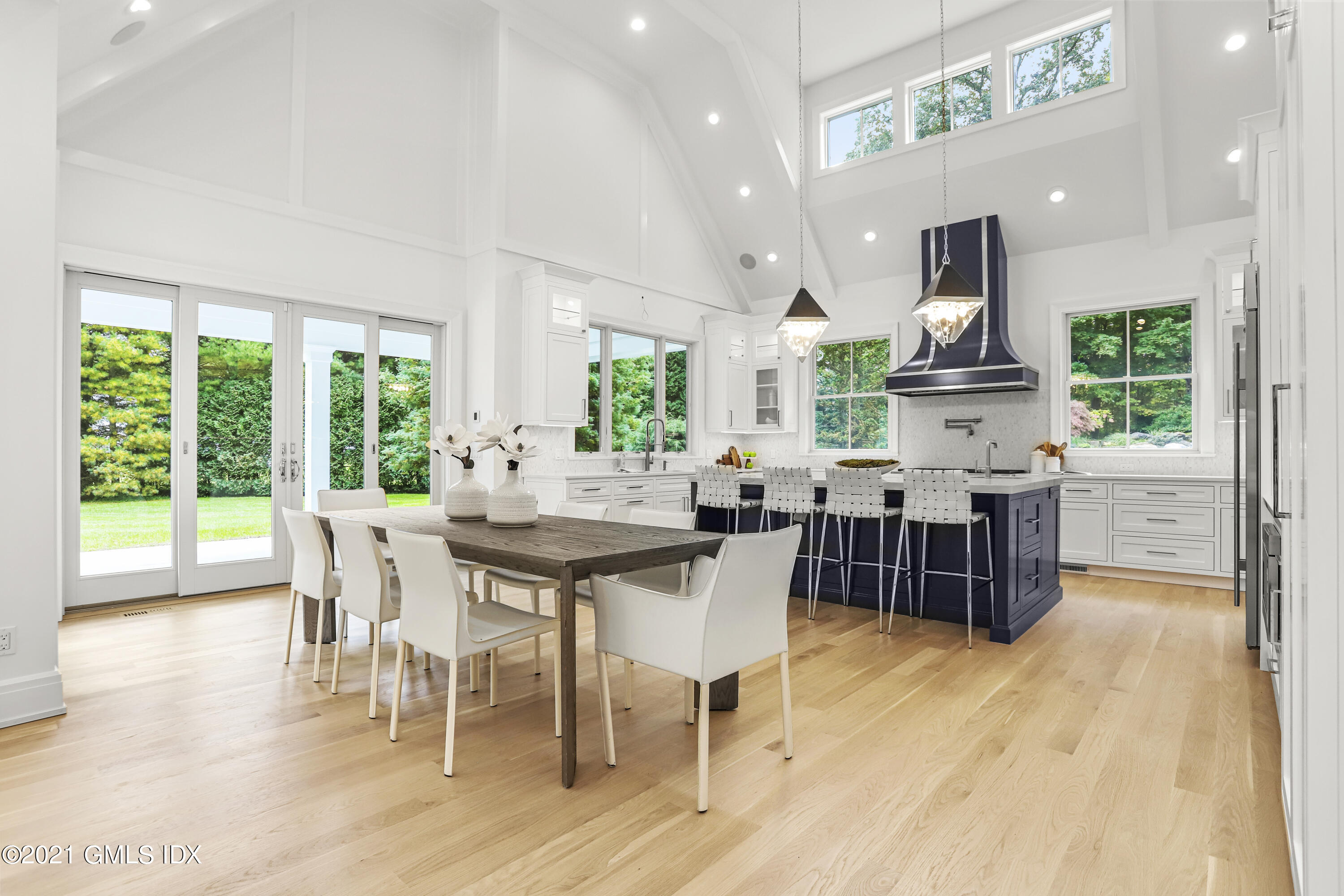 633 Round Hill Road Greenwich, CT 06831 - Photo 5 of 26 a view of a dining room with furniture window and wooden floor