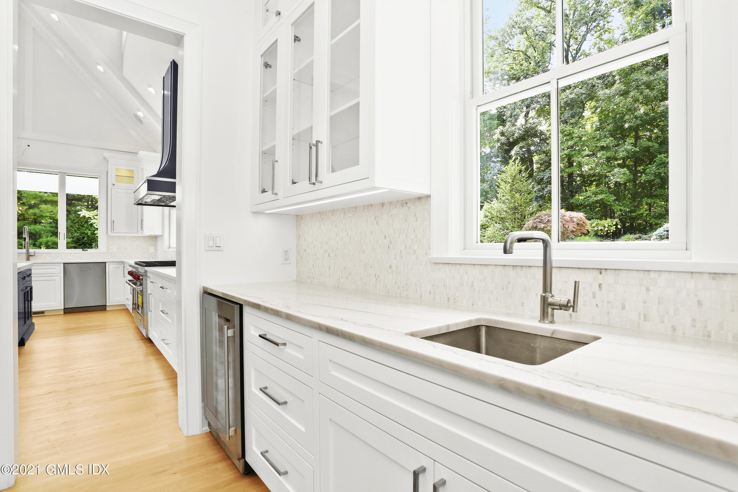 633 Round Hill Road Greenwich, CT 06831 - Photo 10 of 26 a kitchen with stainless steel appliances sink and window