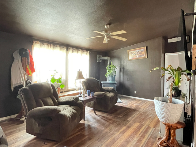 240 Horseshoe Bend Road Vernal, UT 84078 - Photo 11 of 41 Living room featuring hardwood / wood-style flooring, a ceiling fan, and a textured ceiling