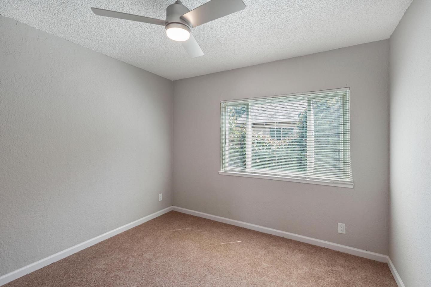 149 Covena Avenue Modesto, CA 95354 - Photo 11 of 24 an empty room with a window