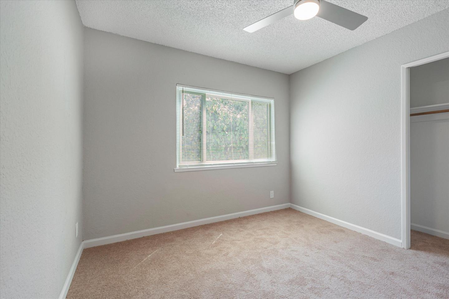 149 Covena Avenue Modesto, CA 95354 - Photo 14 of 24 an empty room with windows