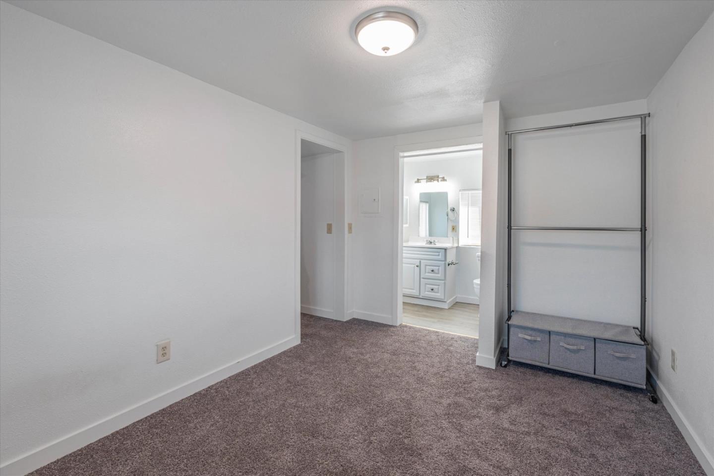 149 Covena Avenue Modesto, CA 95354 - Photo 17 of 24 an empty room with an entrance and door