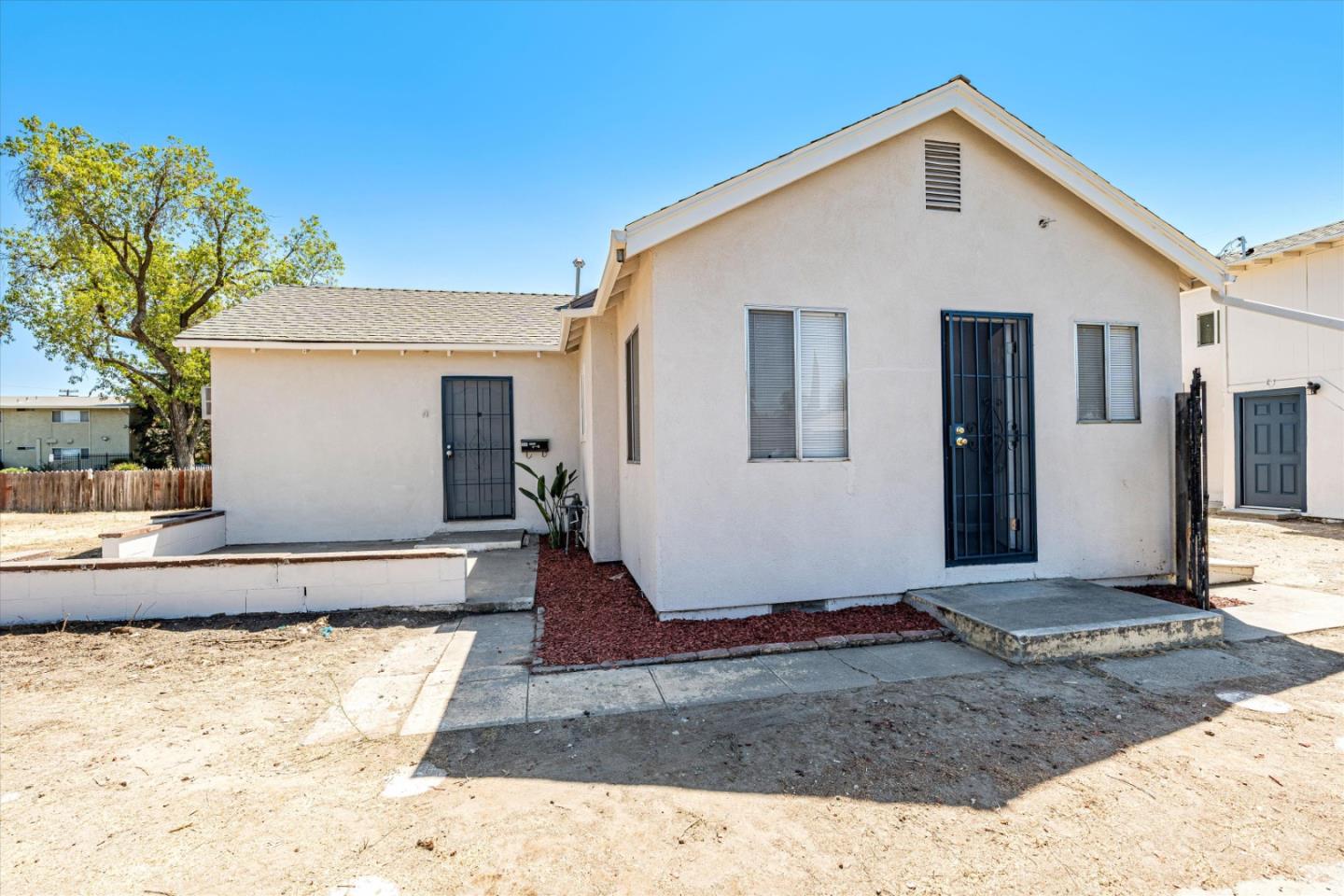 149 Covena Avenue Modesto, CA 95354 - Photo 2 of 24 a view of a house with a yard