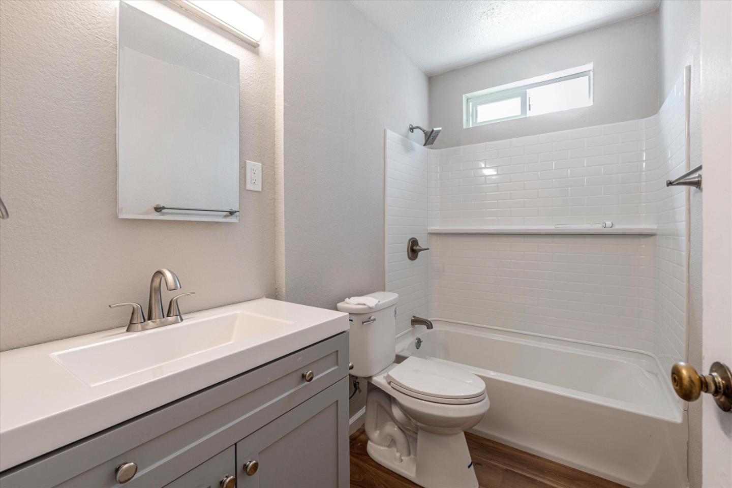 149 Covena Avenue Modesto, CA 95354 - Photo 10 of 24 a bathroom with a sink a toilet and shower
