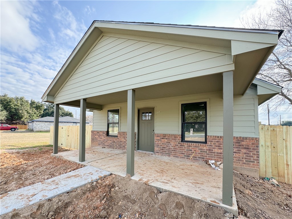 View of front of house featuring brick siding and