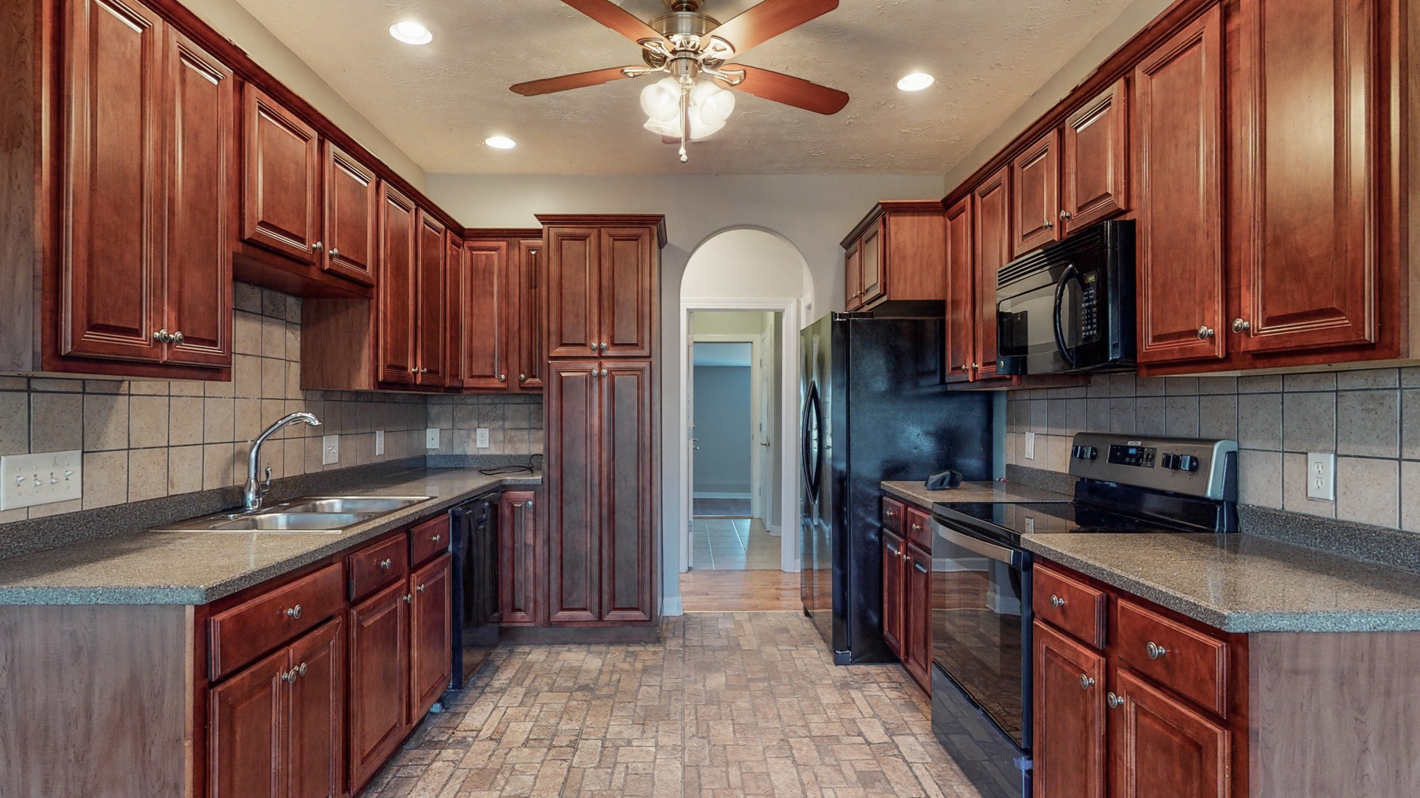 6023 Murfreesboro Road Lebanon, TN 37090 - Photo 13 of 42 a kitchen with stainless steel appliances granite countertop a stove a sink dishwasher and a refrigerator