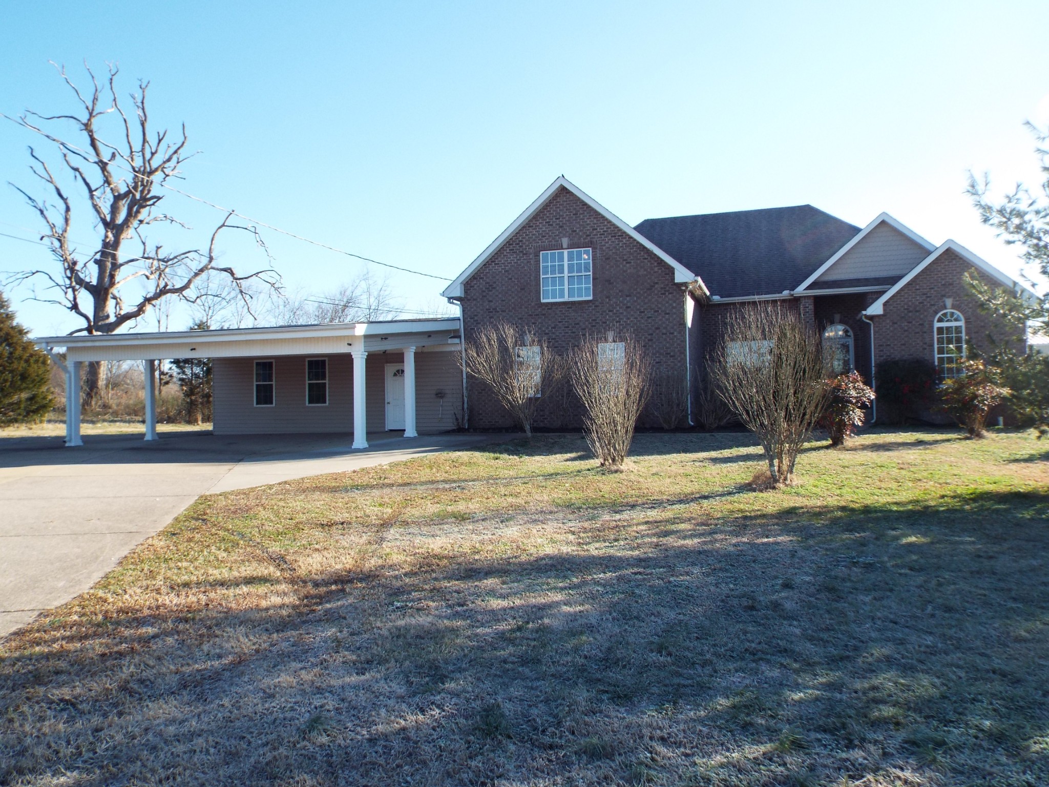 6023 Murfreesboro Road Lebanon, TN 37090 - Photo 2 of 42 a view of a house with swimming pool and a yard