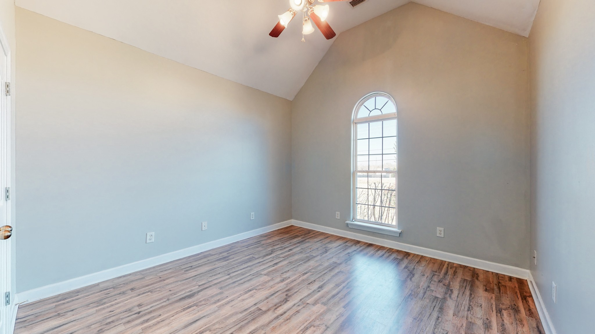 6023 Murfreesboro Road Lebanon, TN 37090 - Photo 28 of 42 an empty room with wooden floor cabinet and windows
