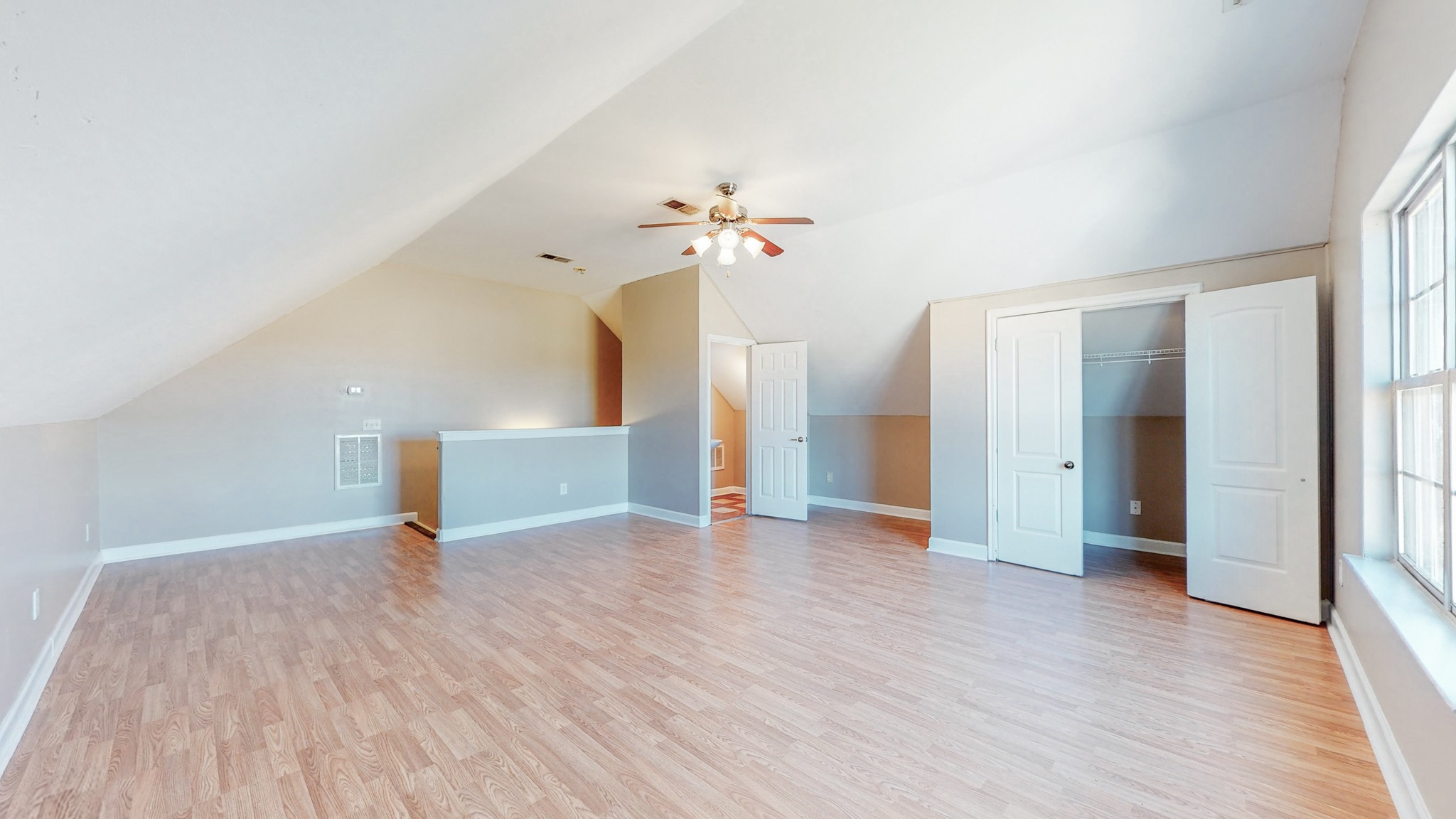 6023 Murfreesboro Road Lebanon, TN 37090 - Photo 31 of 42 a view of an empty room with wooden floor and a ceiling fan