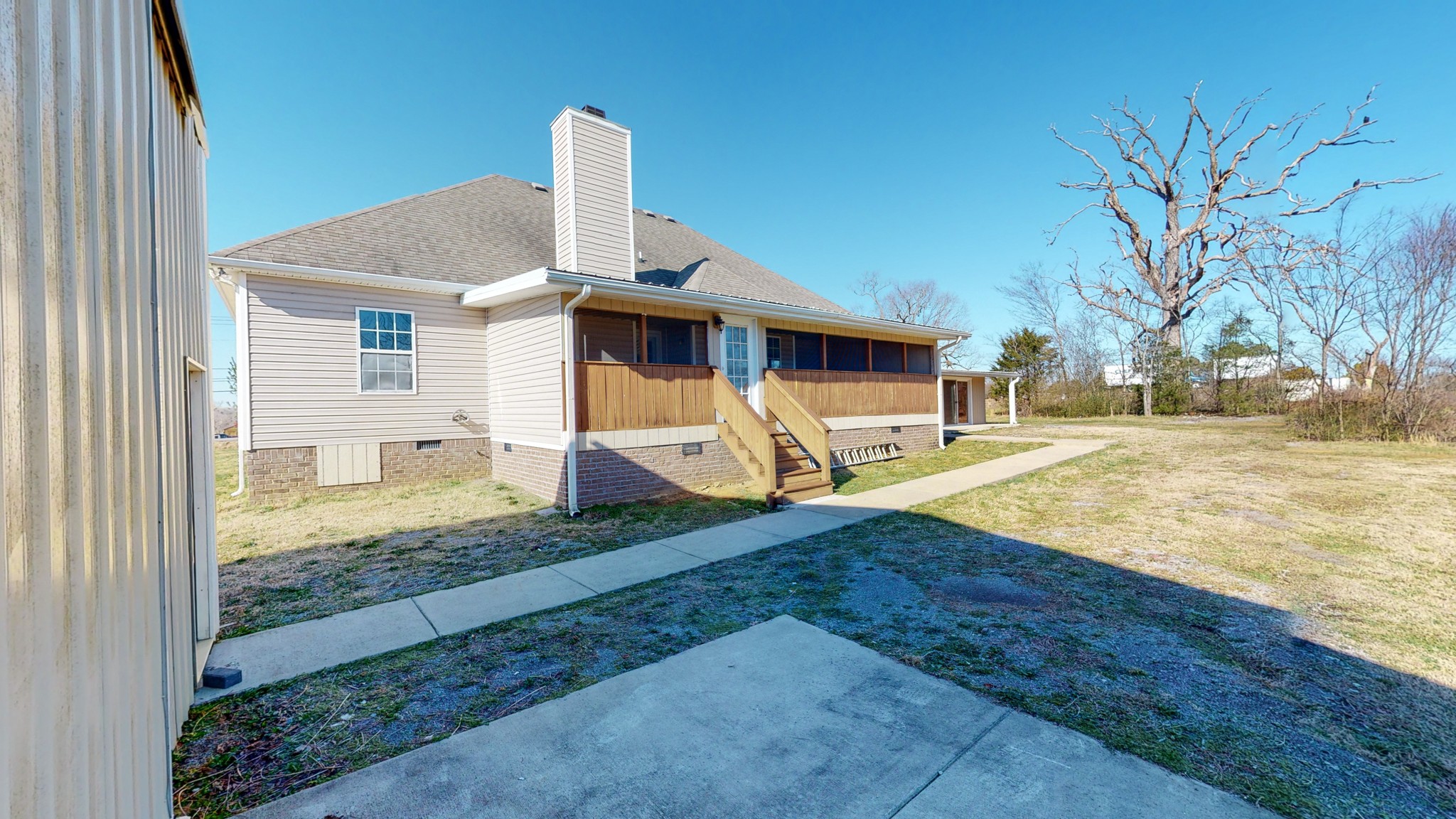 6023 Murfreesboro Road Lebanon, TN 37090 - Photo 35 of 42 a view of a house with a yard