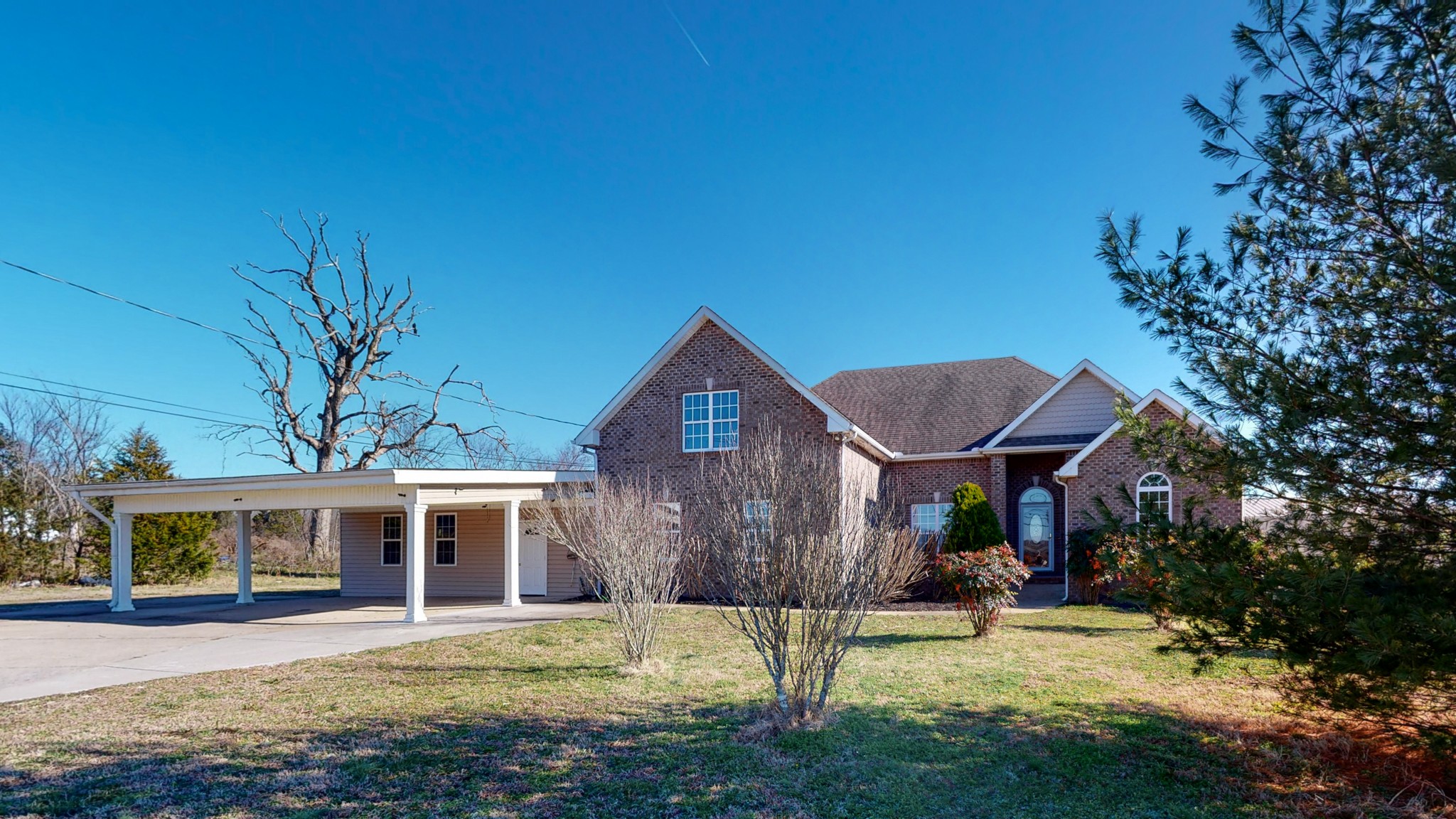 6023 Murfreesboro Road Lebanon, TN 37090 - Photo 7 of 42 a front view of a house with a yard
