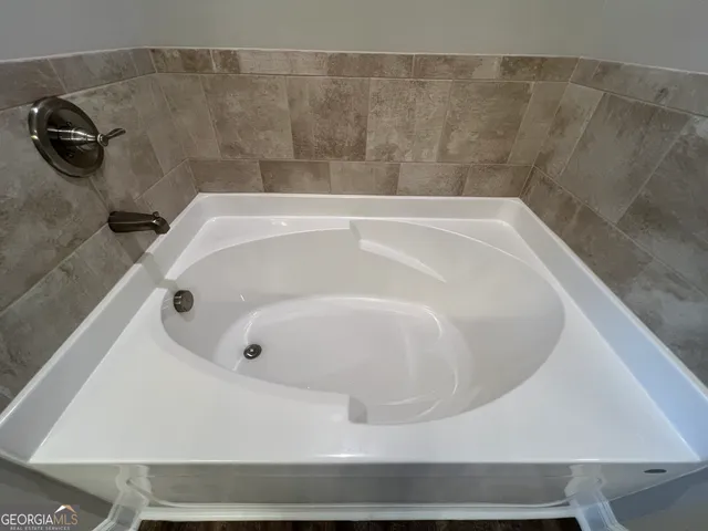 a bath tub sitting in a bathroom