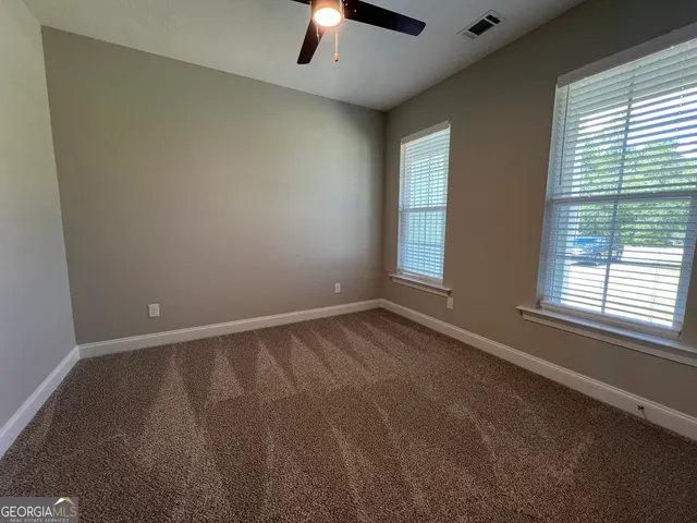 an empty room with a empty space and a window