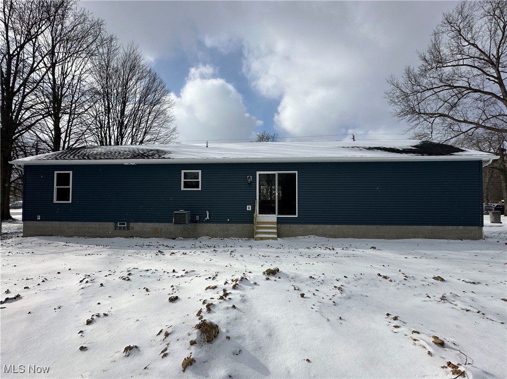1275 South Meridian Road Youngstown, OH 44511 - Photo 2 of 16 Snow covered rear of property featuring entry steps