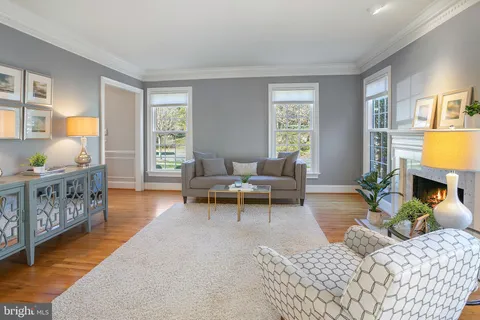 a living room with furniture and a table