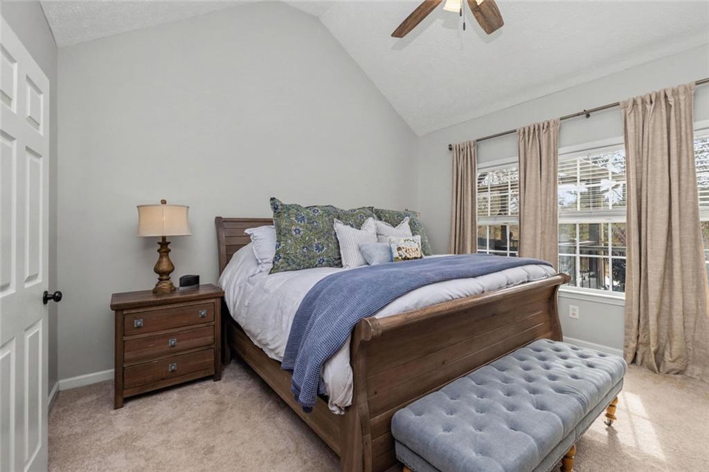 696 Highway 18 Barnesville, GA 30204 - Photo 20 of 57 a bedroom with a bed a couch and a window
