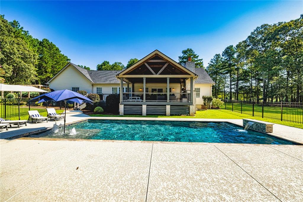 696 Highway 18 Barnesville, GA 30204 - Photo 2 of 57 a view of a house with a yard