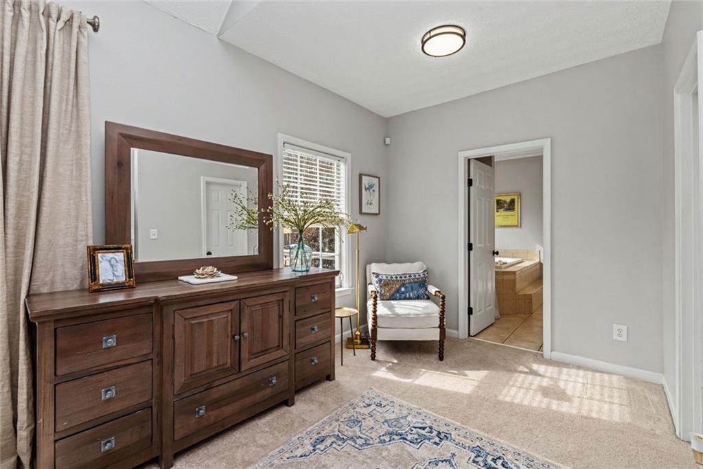 696 Highway 18 Barnesville, GA 30204 - Photo 21 of 57 a spacious bathroom with a double vanity sink and a mirror