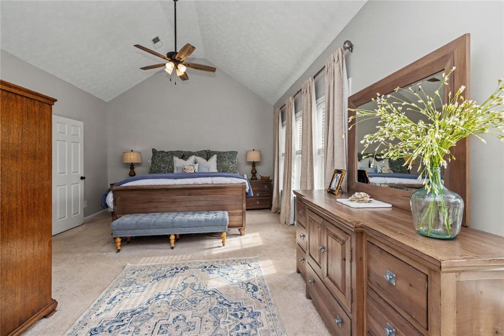 696 Highway 18 Barnesville, GA 30204 - Photo 22 of 57 a bedroom with furniture and a bed