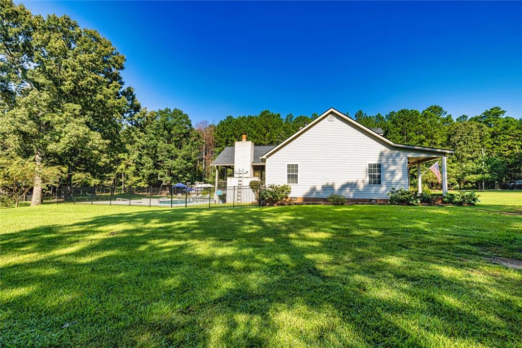696 Highway 18 Barnesville, GA 30204 - Photo 37 of 57 a view of a house and a yard with green space