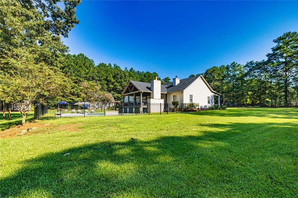 696 Highway 18 Barnesville, GA 30204 - Photo 39 of 57 a view of a house with a yard