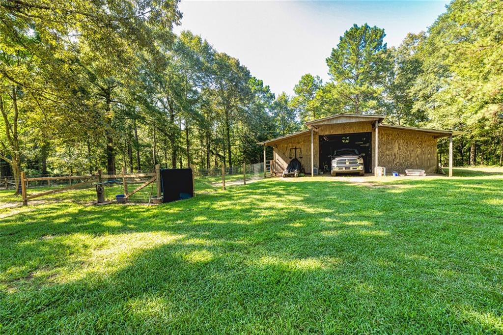 696 Highway 18 Barnesville, GA 30204 - Photo 45 of 57 a front view of a house with garden