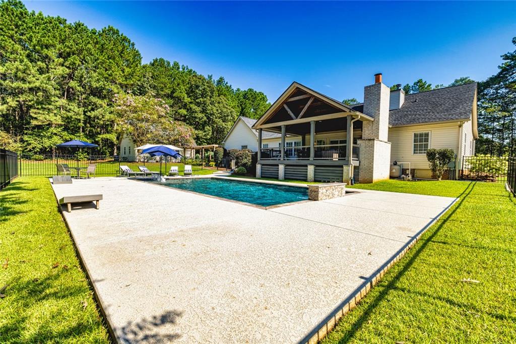 696 Highway 18 Barnesville, GA 30204 - Photo 52 of 57 a view of swimming pool with a yard