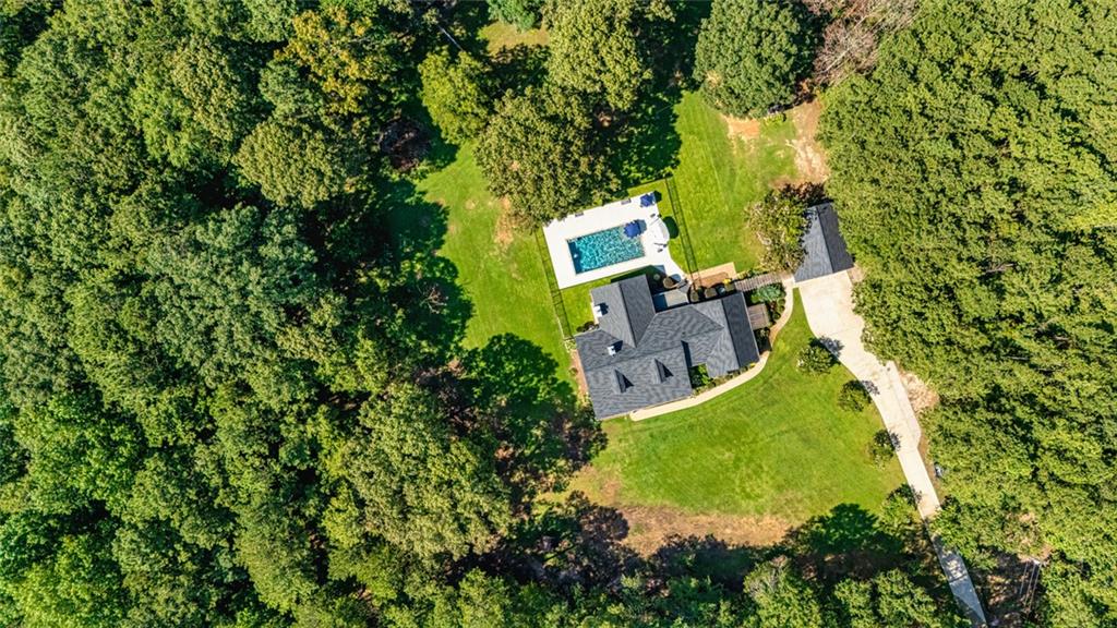 696 Highway 18 Barnesville, GA 30204 - Photo 55 of 57 an aerial view of a house with a garden