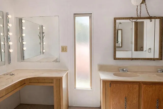 a bathroom with a sink and a mirror