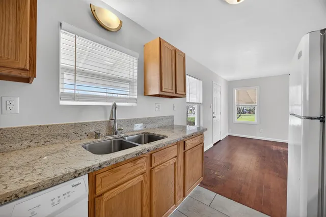 a kitchen with a sink and cabinets