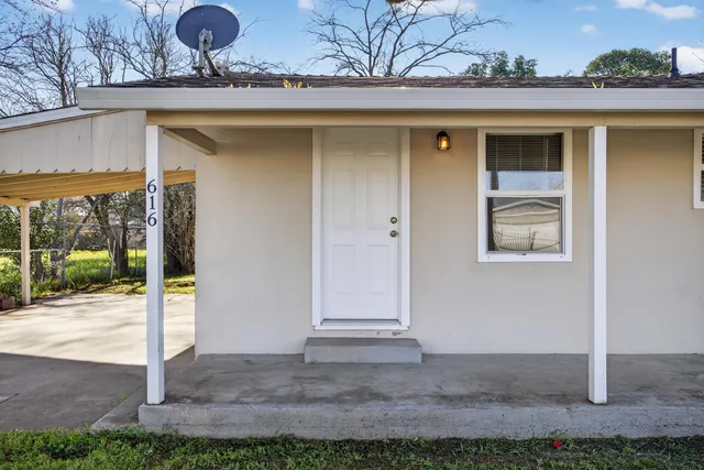 a front view of a house with a porch