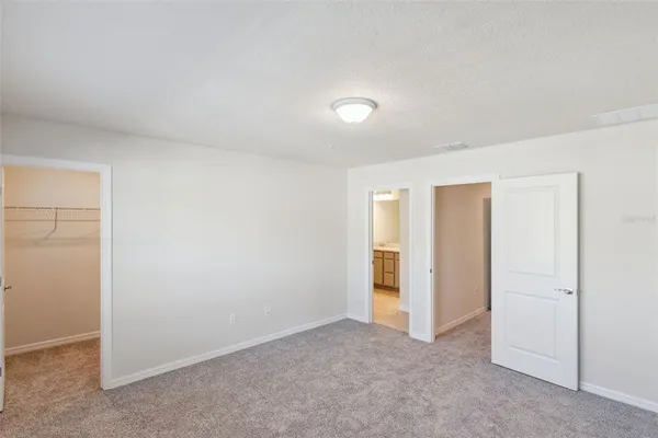 an empty room with closet area