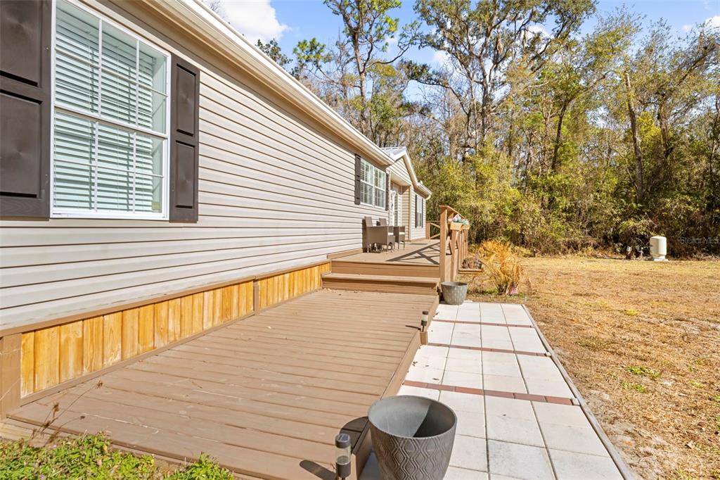 17095 Frankfort Road Brooksville, FL 34601 - Photo 14 of 42 a view of a backyard with large trees