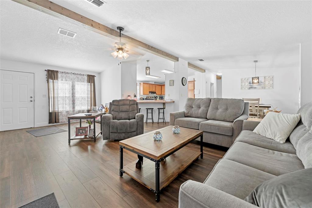 17095 Frankfort Road Brooksville, FL 34601 - Photo 20 of 42 a living room with furniture or wooden floor and a window