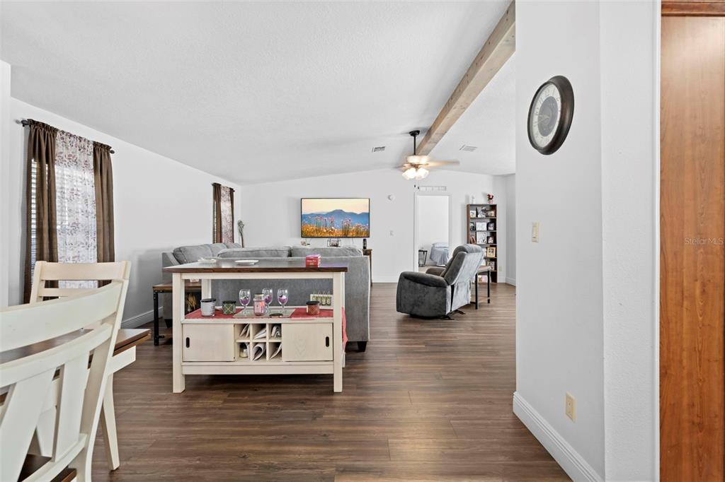 17095 Frankfort Road Brooksville, FL 34601 - Photo 25 of 42 a bedroom with furniture and a wooden floor